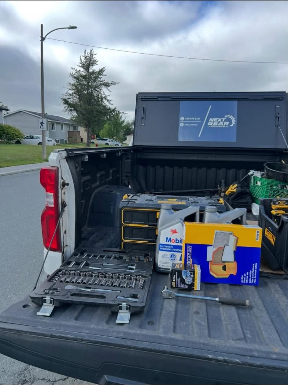 Tool cases and equipment arranged in the open truck bed